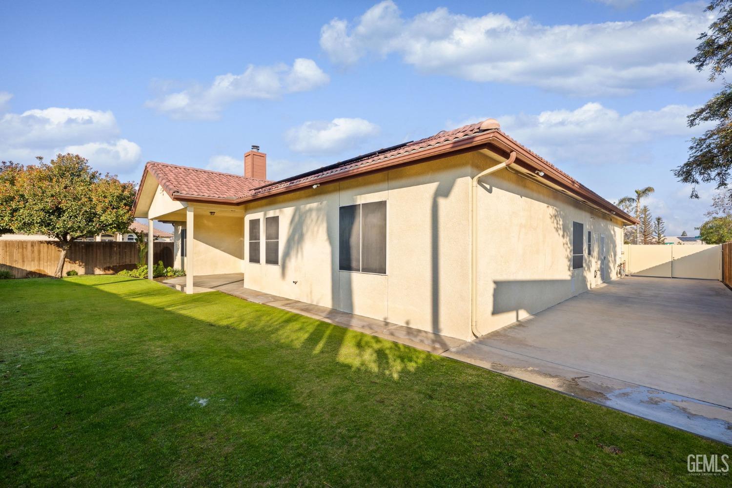 Undisclosed Address Bakersfield, CA 93313 - Photo 45 of 50 a front view of a house with a yard