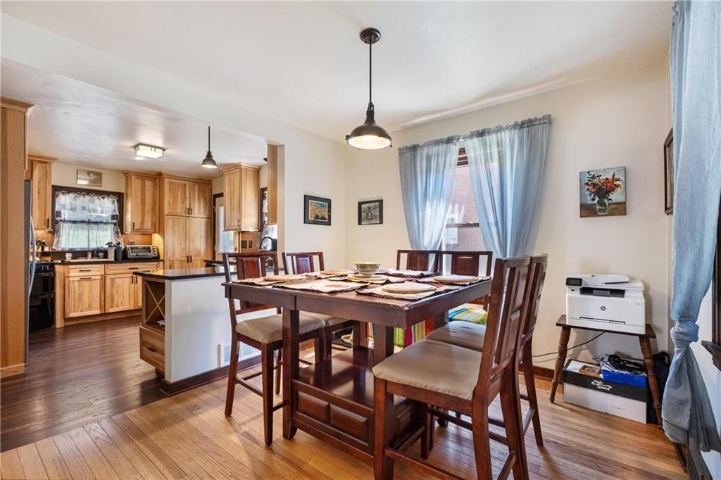 696 Filmore Road Pittsburgh, PA 15221 - Photo 12 of 37 a view of a dining room with furniture window and wooden floor