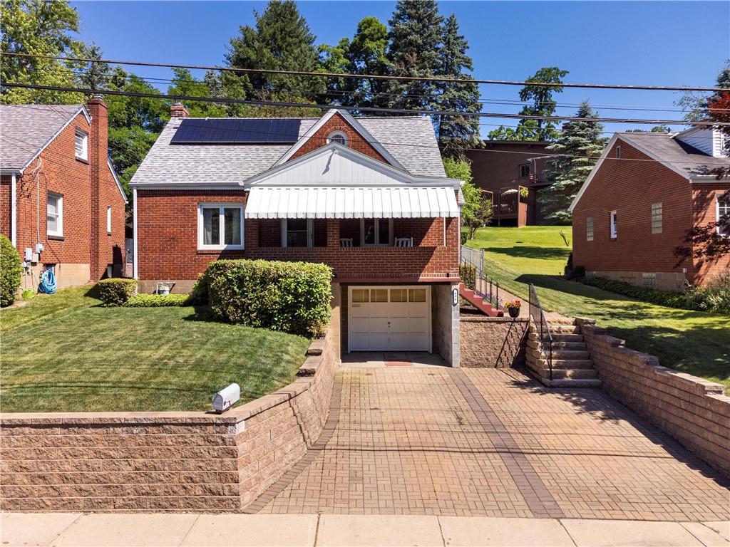 696 Filmore Road Pittsburgh, PA 15221 - Photo 5 of 37 a front view of a house with garden