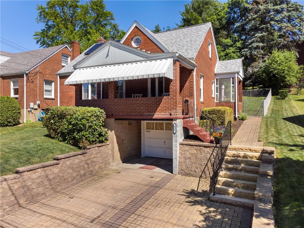 696 Filmore Road Pittsburgh, PA 15221 - Photo 6 of 37 a front view of a house with a yard