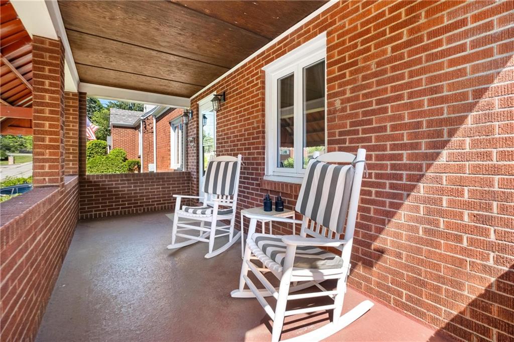 696 Filmore Road Pittsburgh, PA 15221 - Photo 7 of 37 a view of a patio with a table and chairs