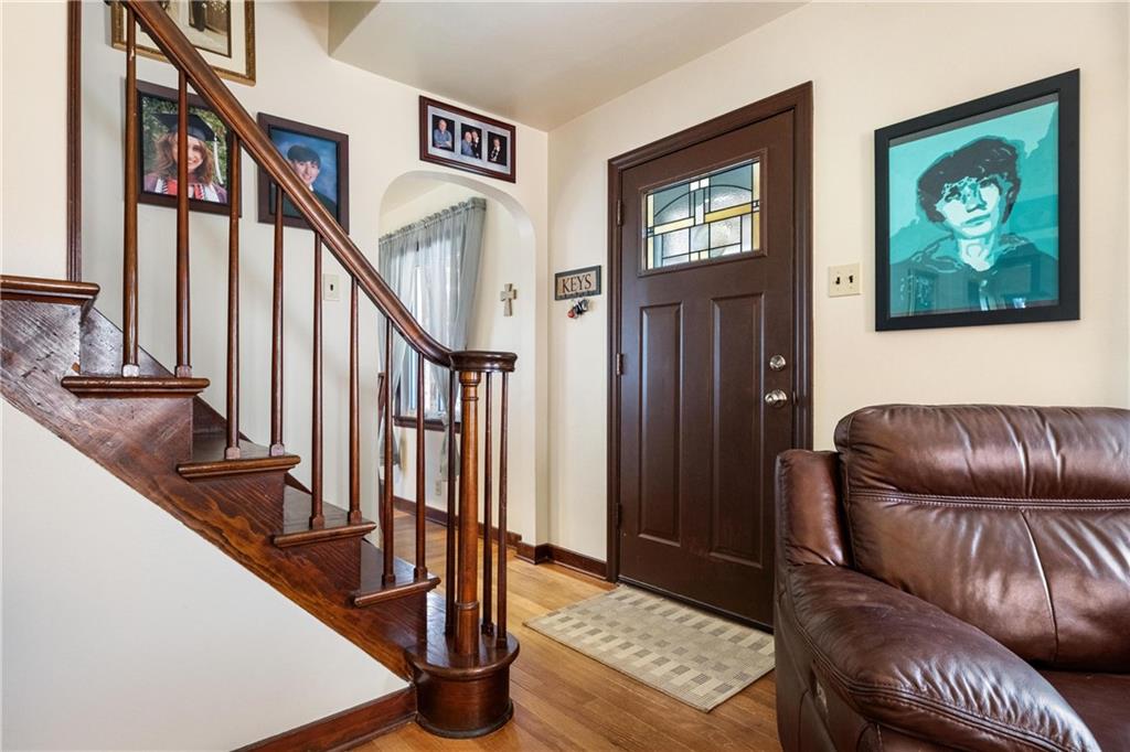 696 Filmore Road Pittsburgh, PA 15221 - Photo 8 of 37 a living room with furniture and stairs