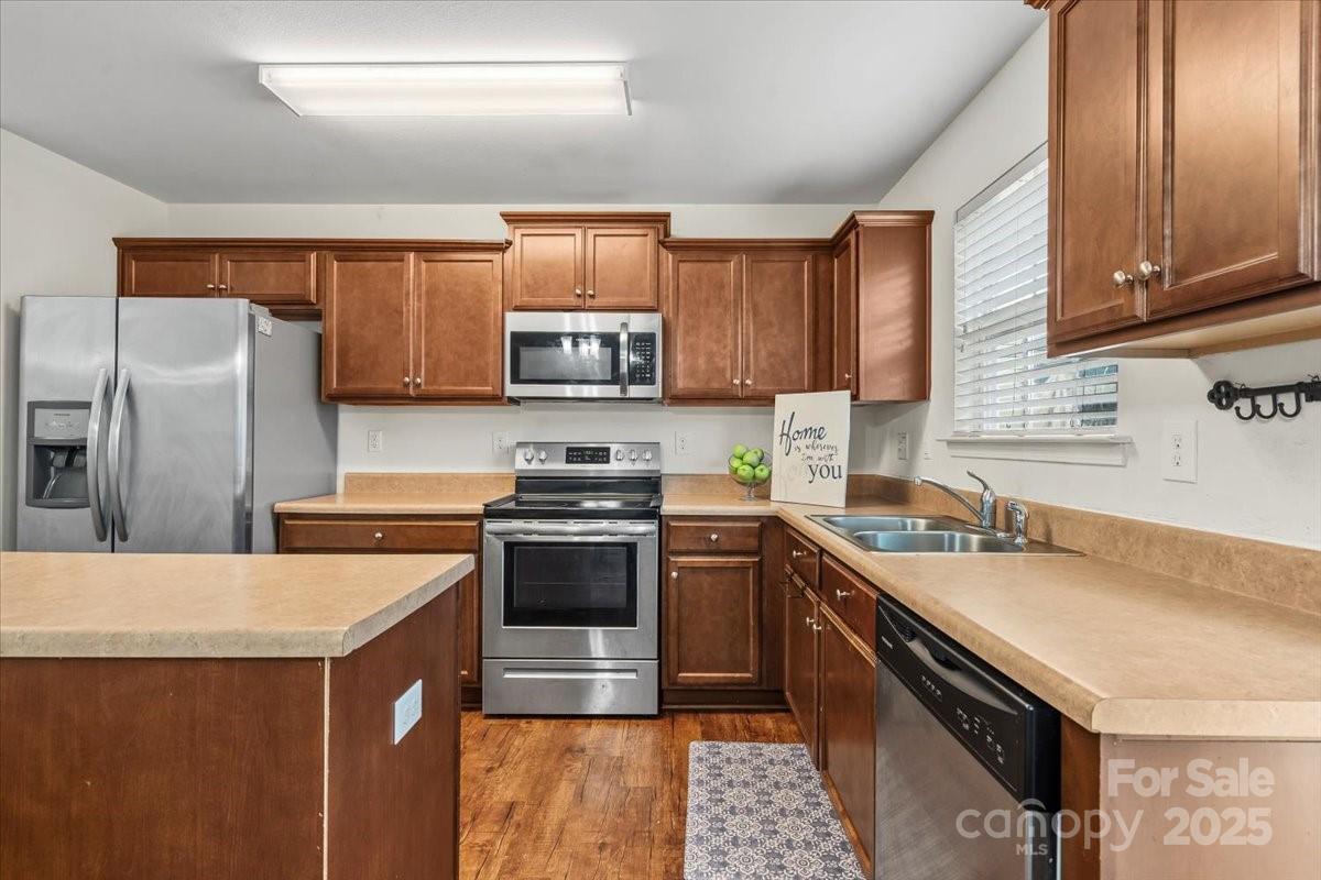 1848 Greenbrook Trail Dallas, NC 28034 - Photo 13 of 33 a kitchen with stainless steel appliances a sink cabinets and a counter top space