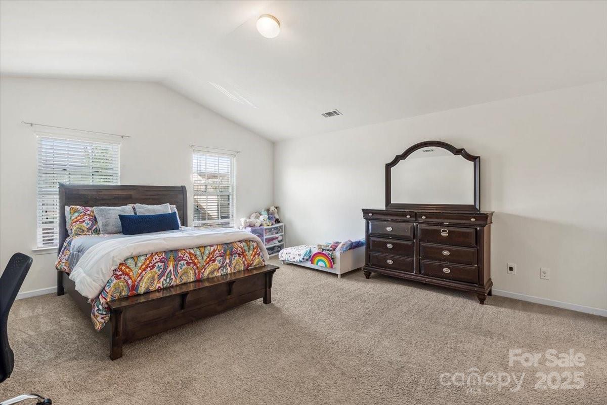 1848 Greenbrook Trail Dallas, NC 28034 - Photo 19 of 33 a bedroom with a bed and a dresser