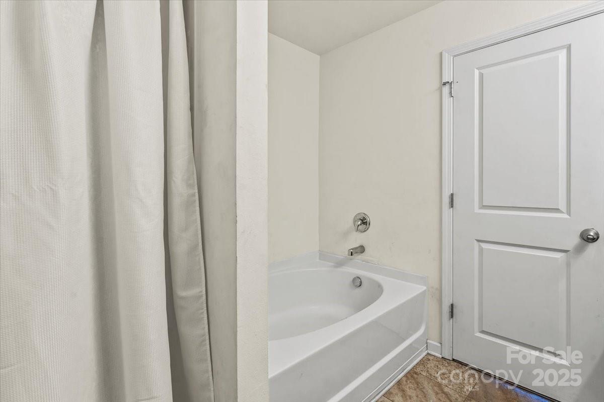 1848 Greenbrook Trail Dallas, NC 28034 - Photo 23 of 33 a bathroom with bathtub and shower