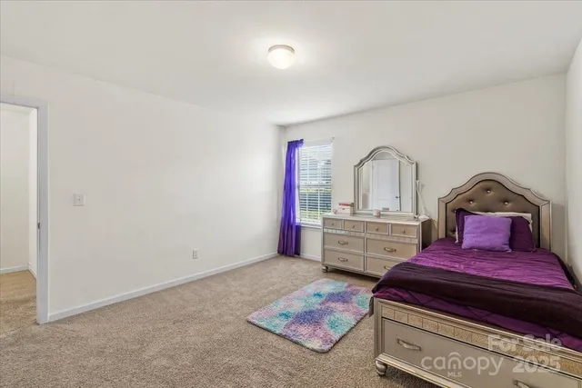 a living room with furniture and flat screen tv