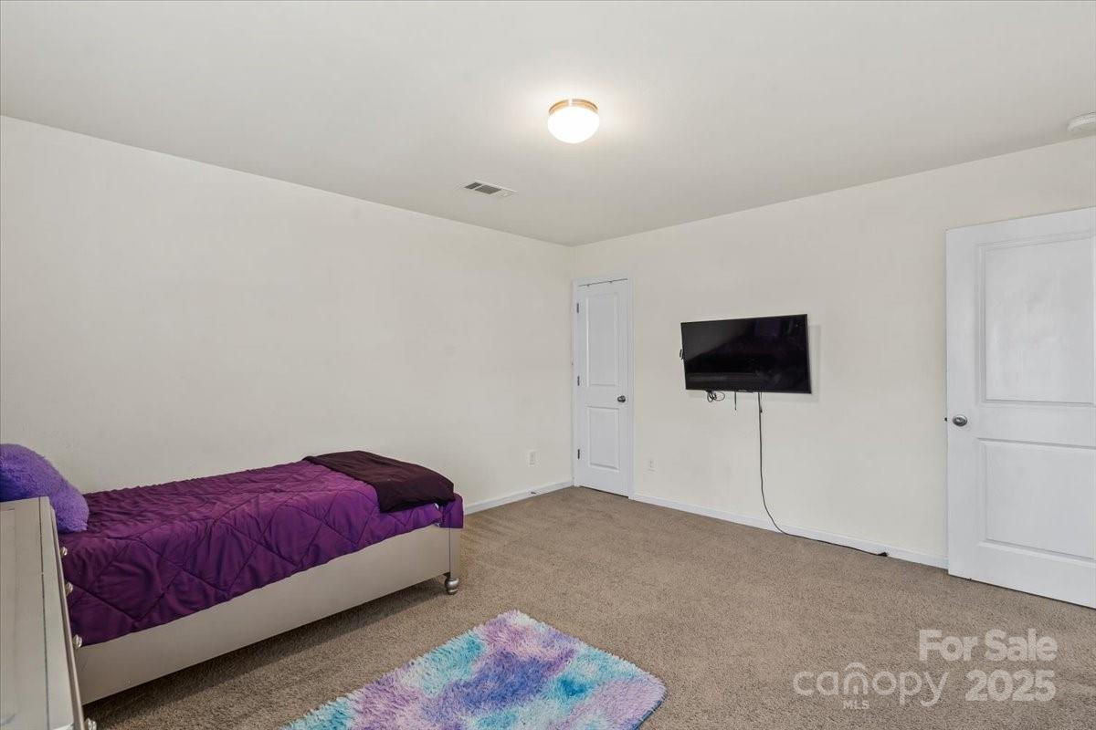 1848 Greenbrook Trail Dallas, NC 28034 - Photo 26 of 33 a living room with a couch and a flat screen tv