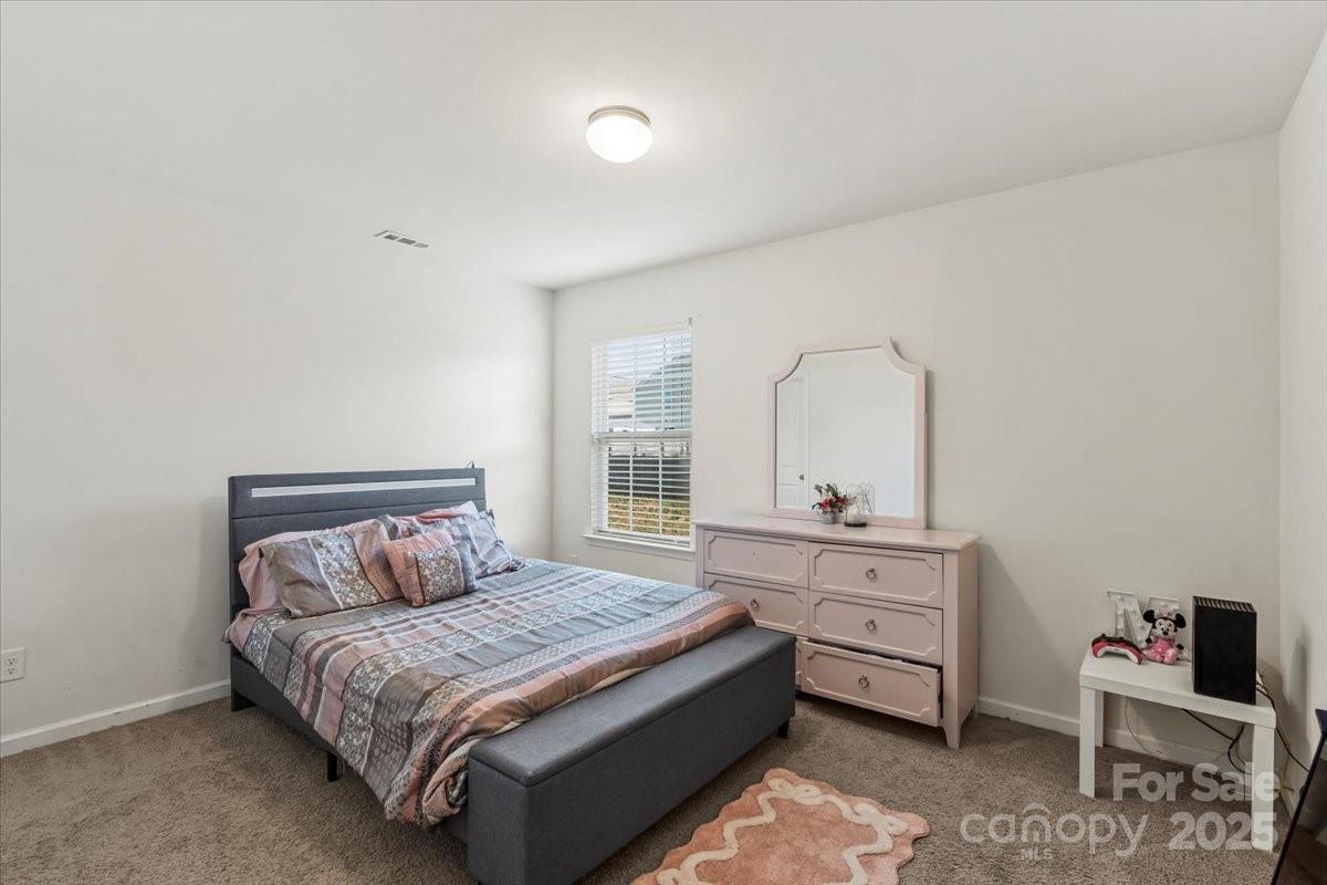 1848 Greenbrook Trail Dallas, NC 28034 - Photo 27 of 33 a bedroom with a bed and a dresser
