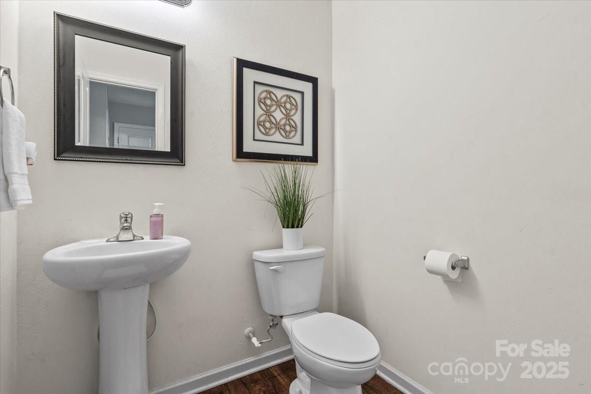 1848 Greenbrook Trail Dallas, NC 28034 - Photo 7 of 33 a bathroom with a toilet sink and mirror