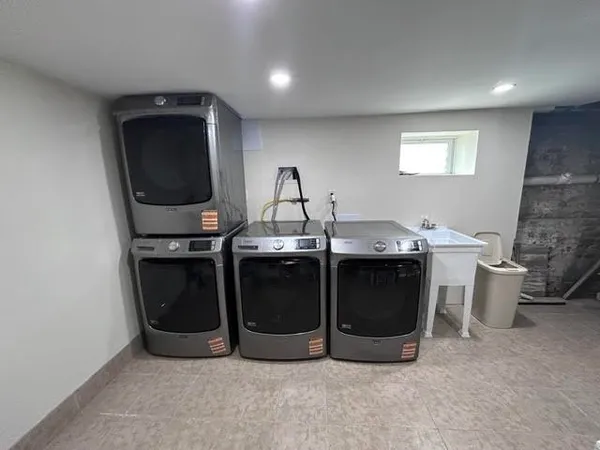 a kitchen with stainless steel appliances a stove and a refrigerator