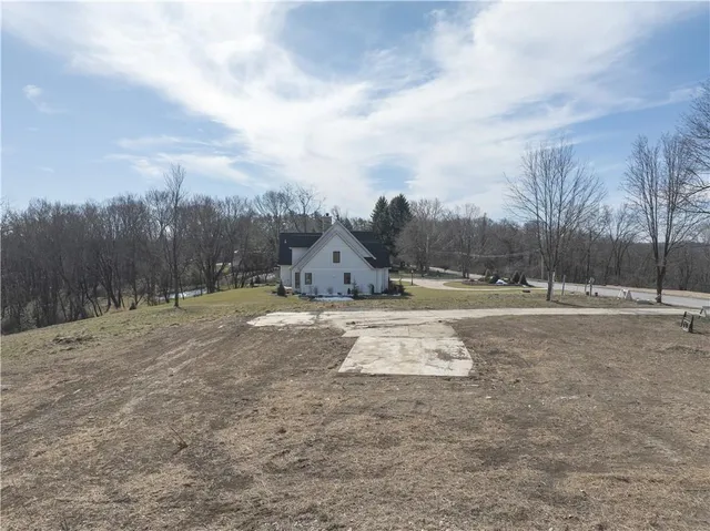a view of open space with green field