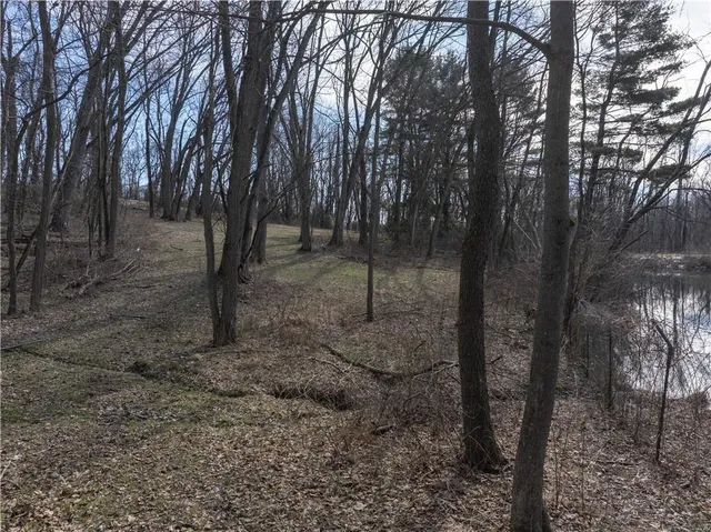 a lake view with outdoor seating