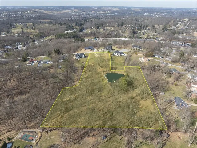 a aerial view of residential houses with outdoor space