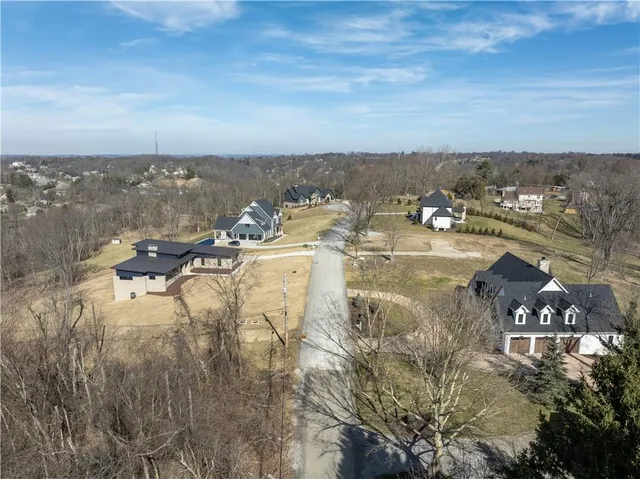 an aerial view of residential house and outdoor space