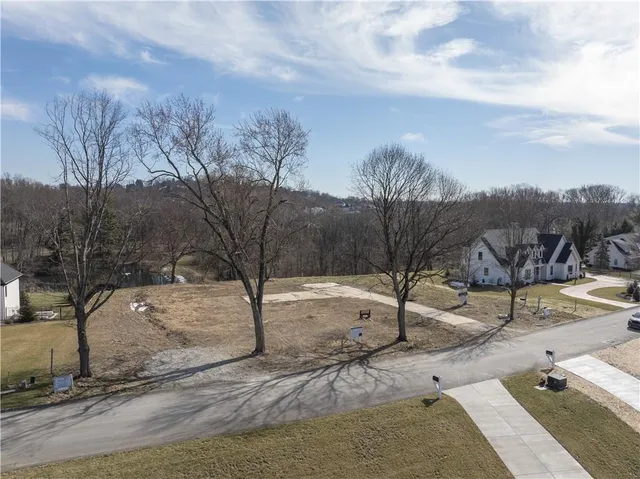 a view of a yard with a snow on the road
