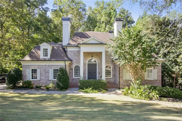 front view of a house with a small yard