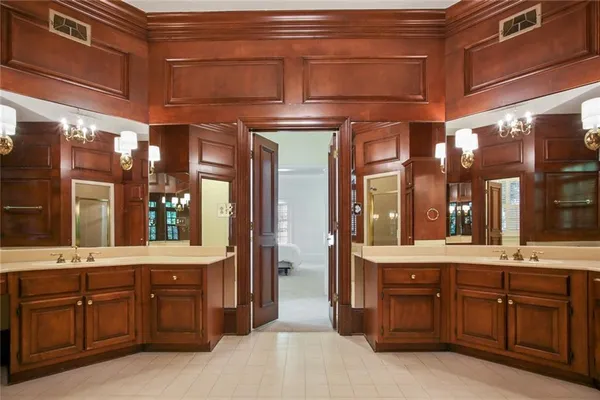 a bathroom with a sink and a large mirror