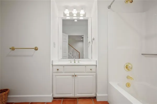 a bathroom with a bathtub and a sink
