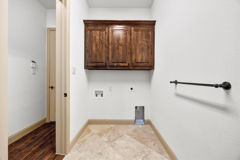 6814 Springwood Lane Garland, TX 75044 - Photo 27 of 35 a view of an empty room with wooden floor and a window