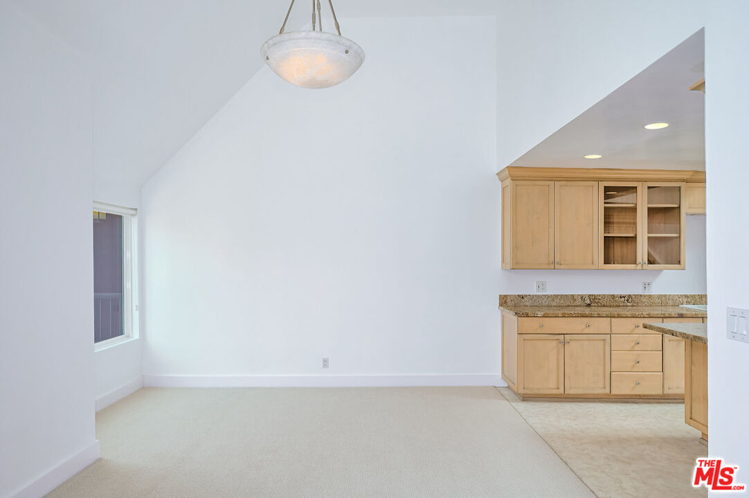 4250 Vía Dolce, Unit 321 Marina del Rey, CA 90292 - Photo 12 of 42 a view of a kitchen with a sink and a refrigerator