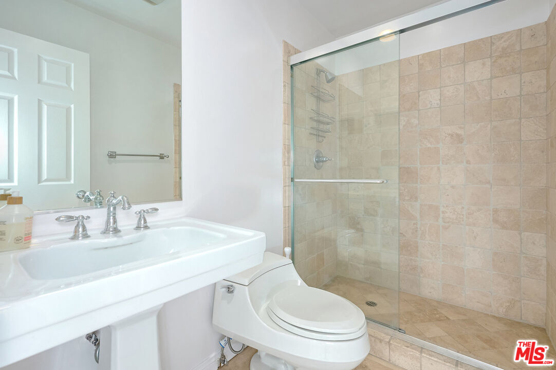 4250 Vía Dolce, Unit 321 Marina del Rey, CA 90292 - Photo 20 of 42 a bathroom with a sink toilet and shower