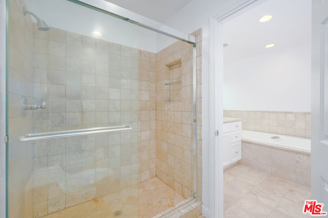 4250 Vía Dolce, Unit 321 Marina del Rey, CA 90292 - Photo 26 of 42 a bathroom with a shower and a toilet