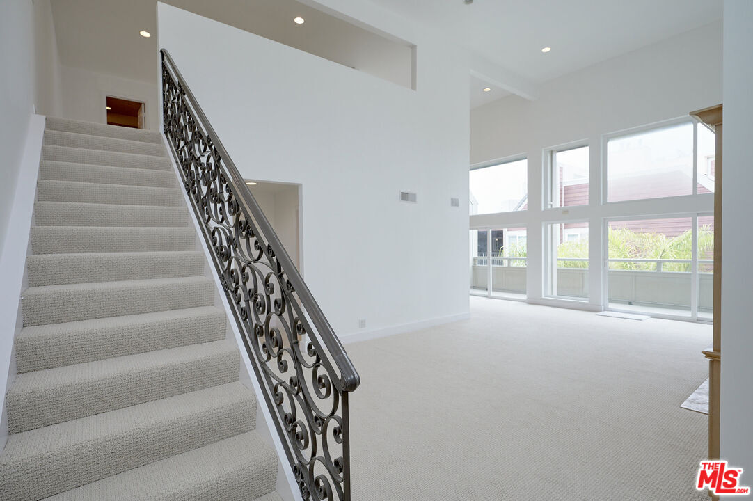 4250 Vía Dolce, Unit 321 Marina del Rey, CA 90292 - Photo 3 of 42 a view of an entryway with staircase
