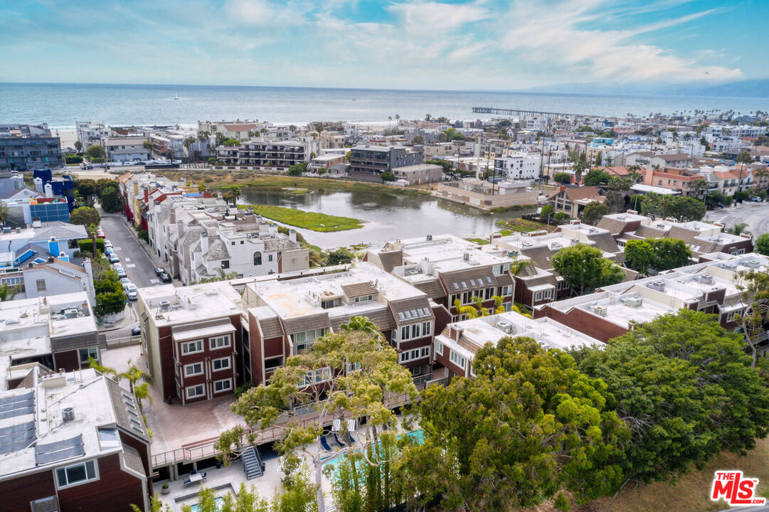 4250 Vía Dolce, Unit 321 Marina del Rey, CA 90292 - Photo 37 of 42 an aerial view of a city with lots of residential buildings ocean and mountain view in back