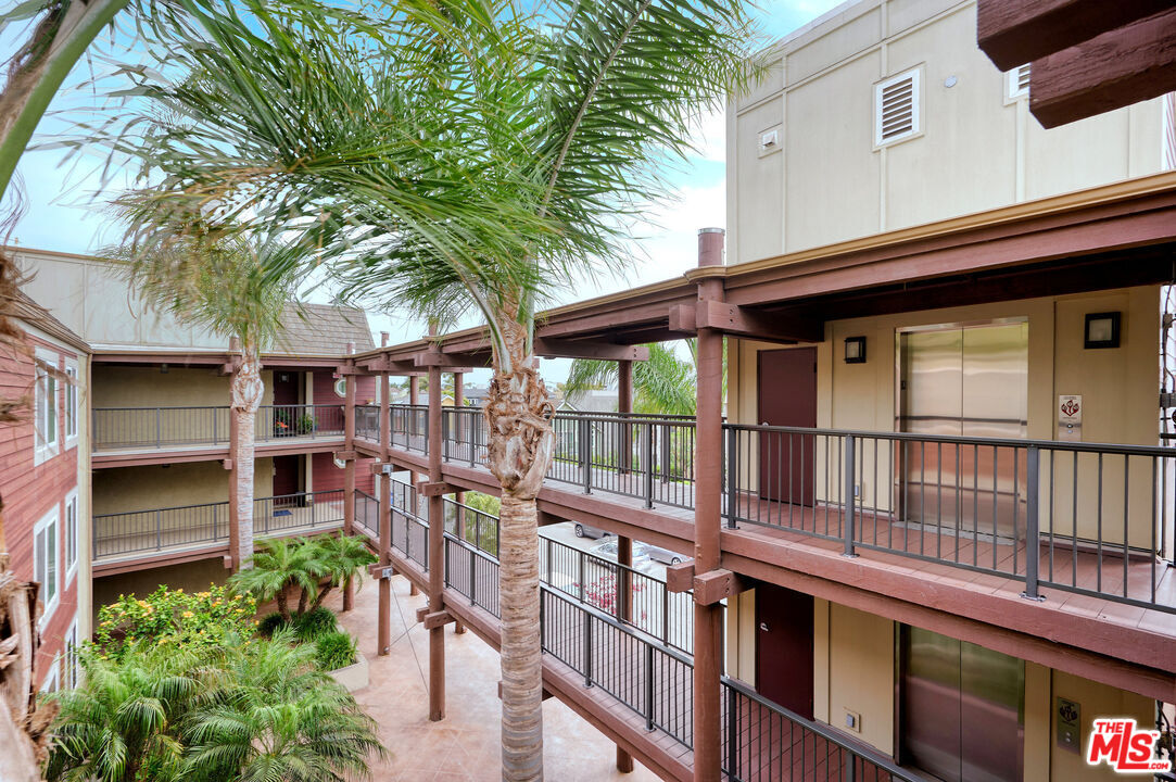 4250 Vía Dolce, Unit 321 Marina del Rey, CA 90292 - Photo 38 of 42 a view of a house with a large window and stairs