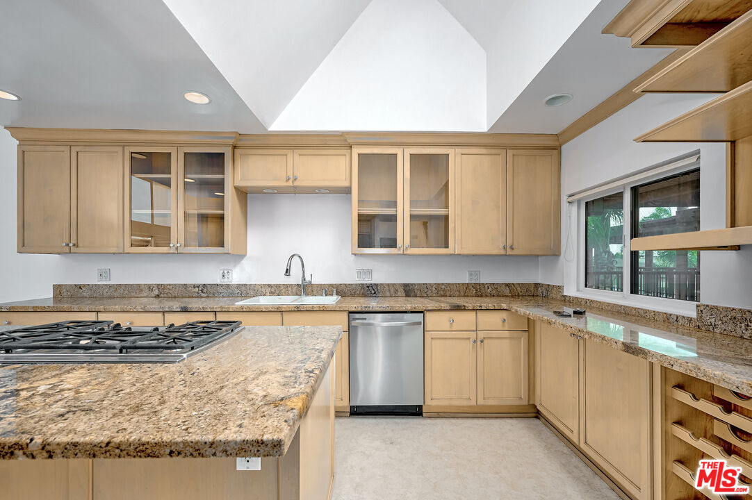 4250 Vía Dolce, Unit 321 Marina del Rey, CA 90292 - Photo 7 of 42 a kitchen with a sink stove and cabinets