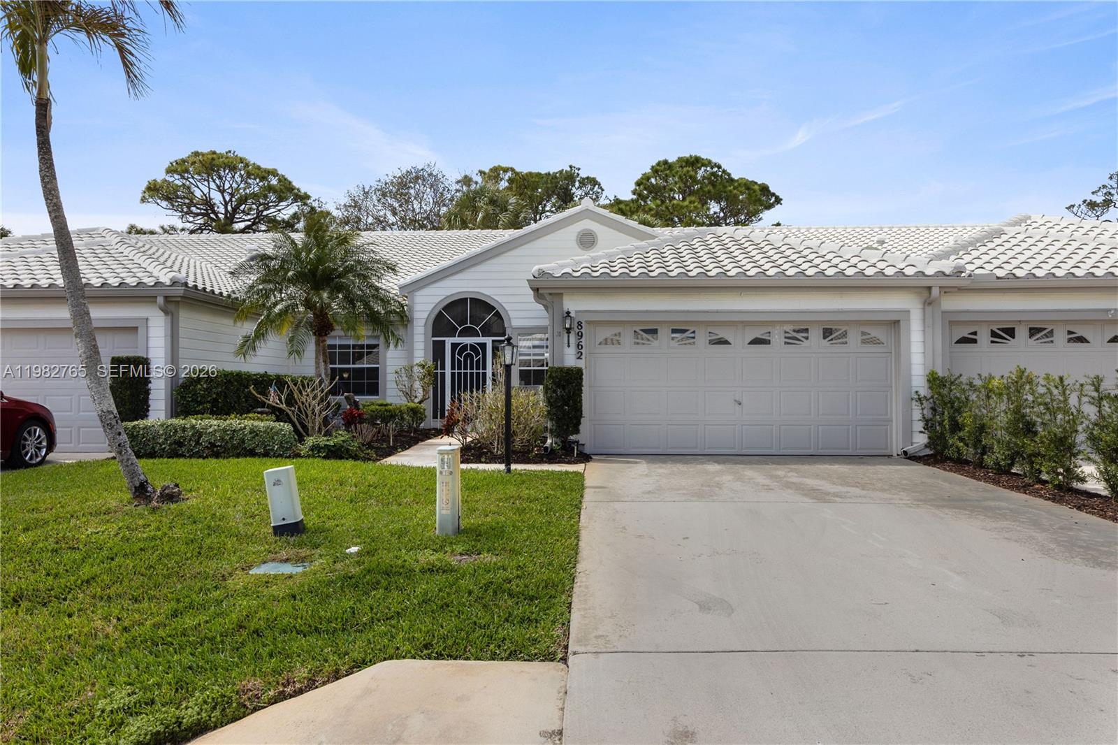 8962 Southeast Riverfront Terrace Jupiter, FL 33469 - Photo 20 of 20 a front view of a house with a yard