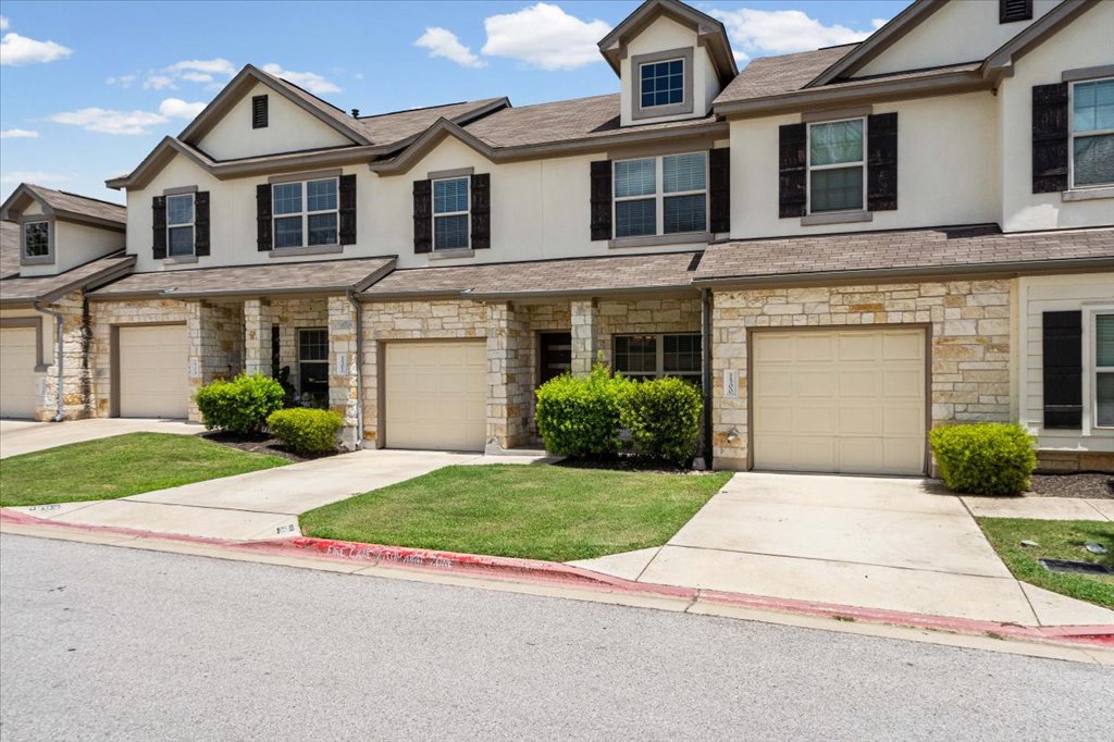 1502 Airedale Road, Unit 2502 Austin, TX 78748 - Photo 26 of 28 Stone veneer and a neatly maintained lawn elevate this townhome's curb appeal.