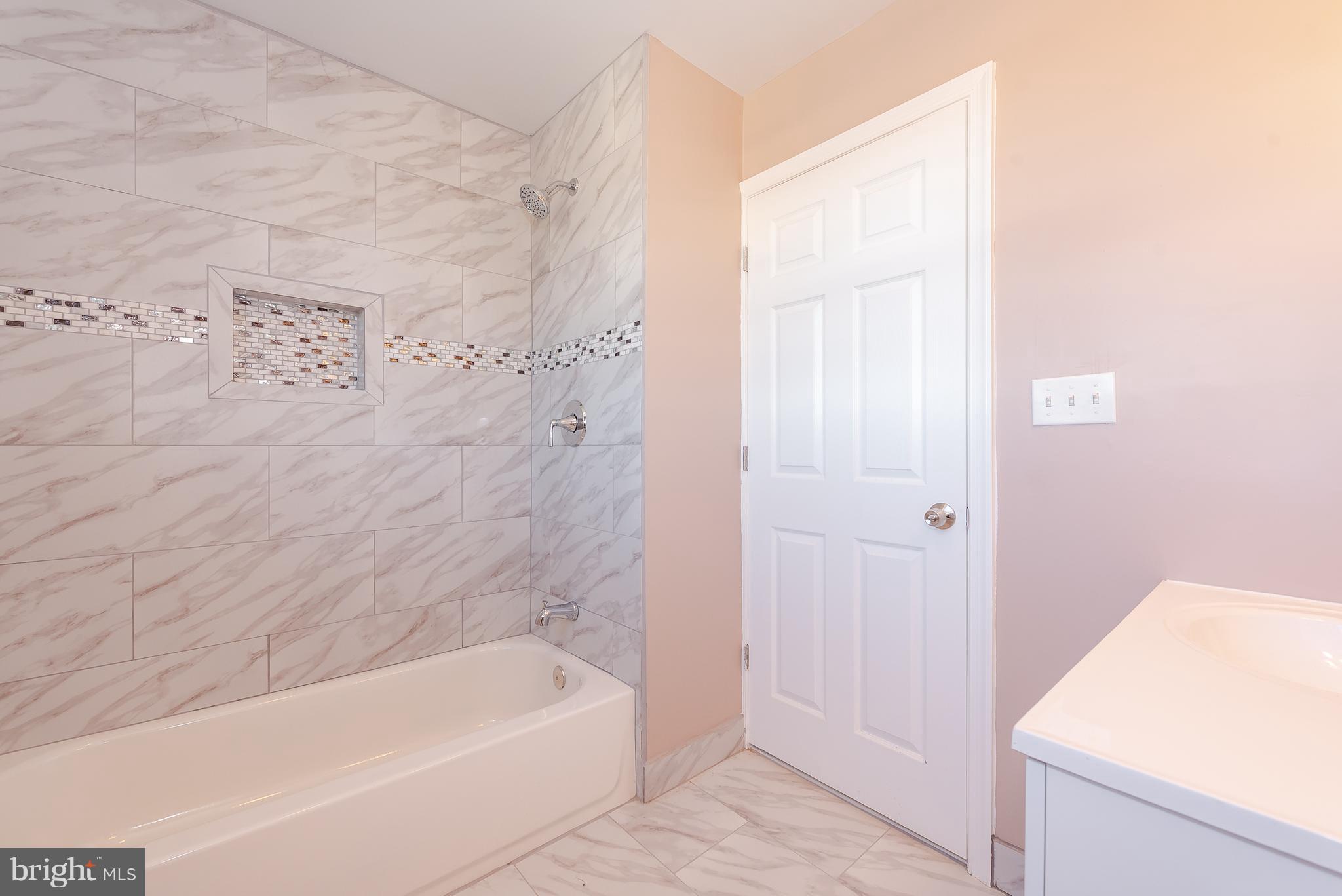 3327 Essex Road Baltimore, MD 21207 - Photo 19 of 35 a bathroom with a bathtub