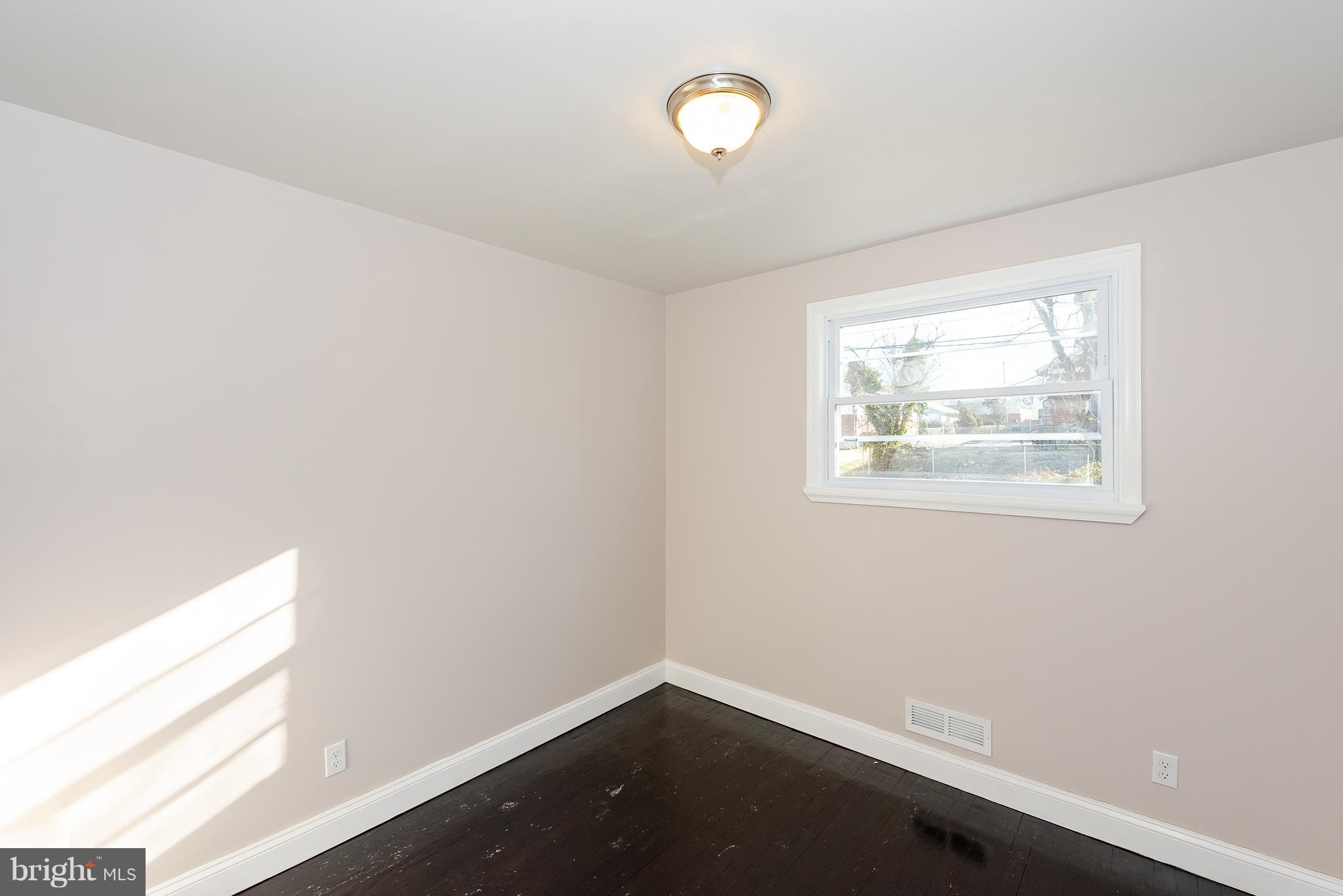 3327 Essex Road Baltimore, MD 21207 - Photo 23 of 35 an empty room with a window