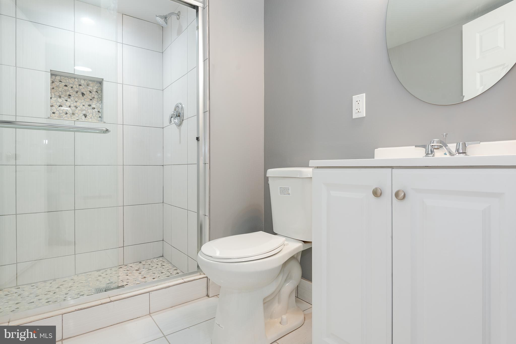 3327 Essex Road Baltimore, MD 21207 - Photo 30 of 35 a bathroom with a sink toilet and shower