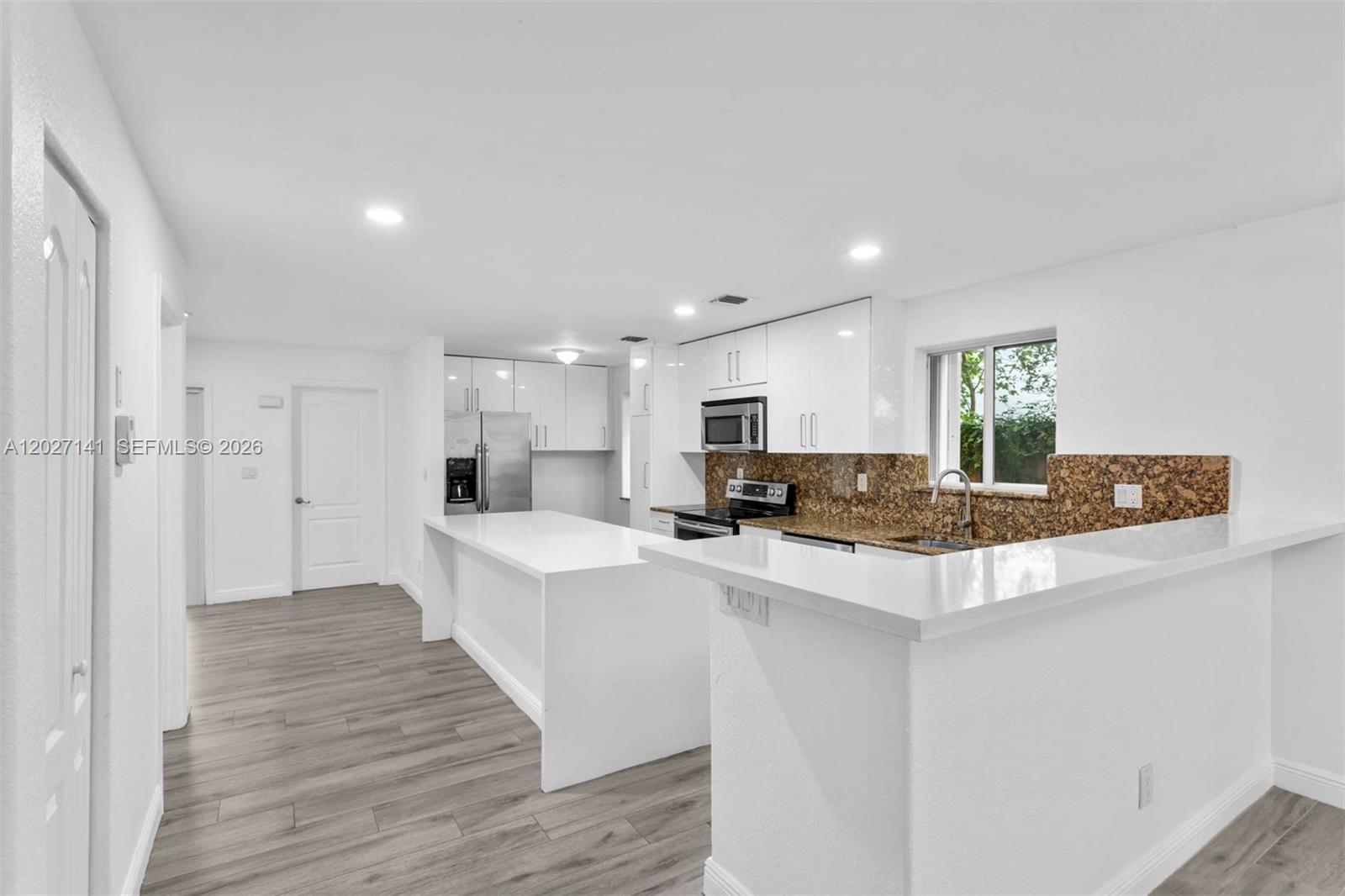 3062 Matilda Street, Unit 2 Miami, FL 33133 - Photo 8 of 32 Plenty of space for stools in the kitchen counter and island