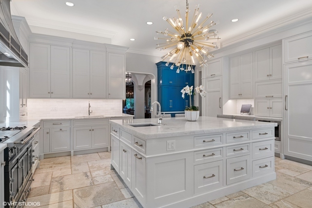145 Oxford Road Kenilworth, IL 60043 - Photo 19 of 66 a kitchen with a sink stove and cabinets