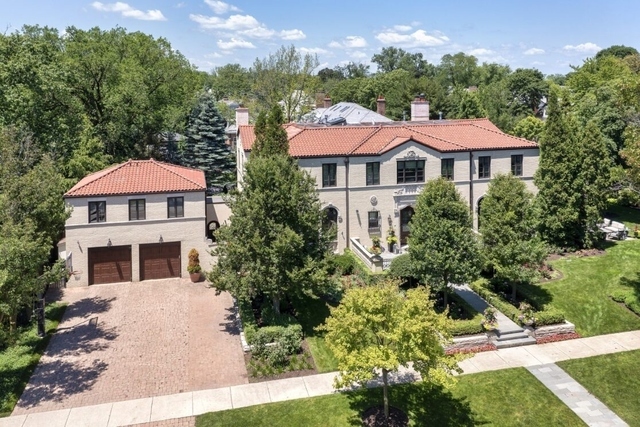 145 Oxford Road Kenilworth, IL 60043 - Photo 2 of 66 a front view of a residential houses with yard and green space