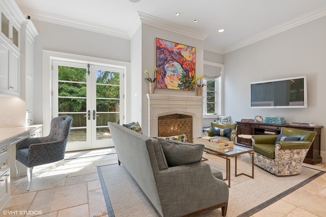 145 Oxford Road Kenilworth, IL 60043 - Photo 25 of 66 a living room with furniture a flat screen tv and a fireplace