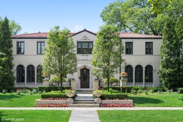 145 Oxford Road Kenilworth, IL 60043 - Photo 3 of 66 a front view of a house with a garden