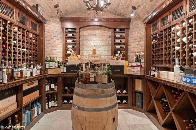 145 Oxford Road Kenilworth, IL 60043 - Photo 35 of 66 a picture of a living room with a furniture and a large window