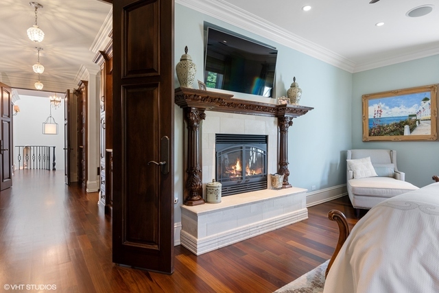 145 Oxford Road Kenilworth, IL 60043 - Photo 40 of 66 a living room with furniture and a fireplace