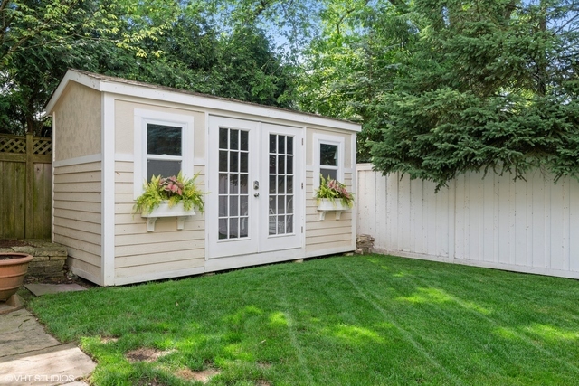 145 Oxford Road Kenilworth, IL 60043 - Photo 55 of 66 a view of a house with a backyard