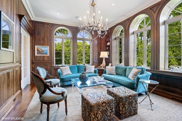 145 Oxford Road Kenilworth, IL 60043 - Photo 9 of 66 a living room with patio furniture and a large window