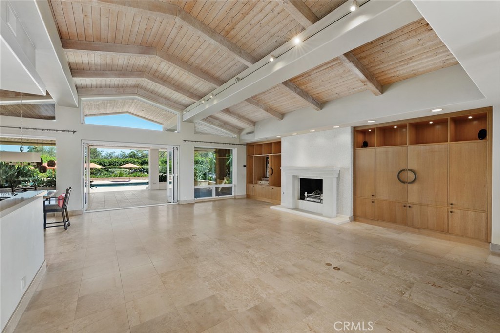 6533 Lago Lindo Rancho Santa Fe, CA 92067 - Photo 18 of 57 a view of an empty room with a fireplace and a window