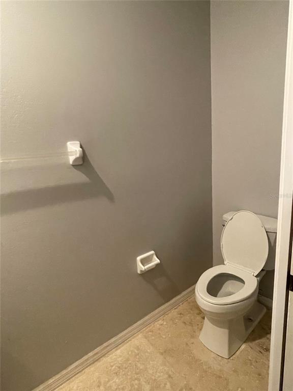 759 Fordingbridge Way Osprey, FL 34229 - Photo 24 of 51 a white toilet sitting in a bathroom