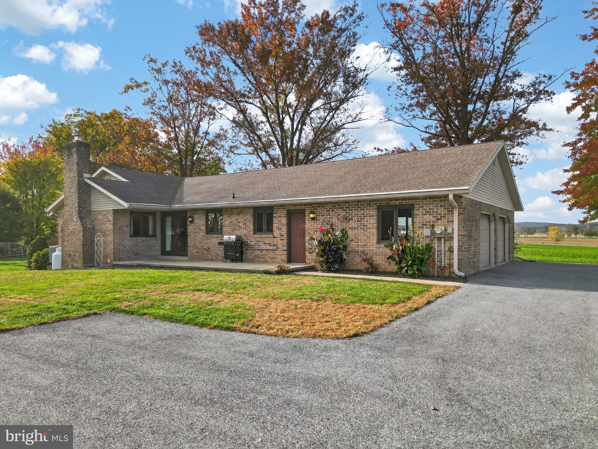 a front view of a house with a yard and porch