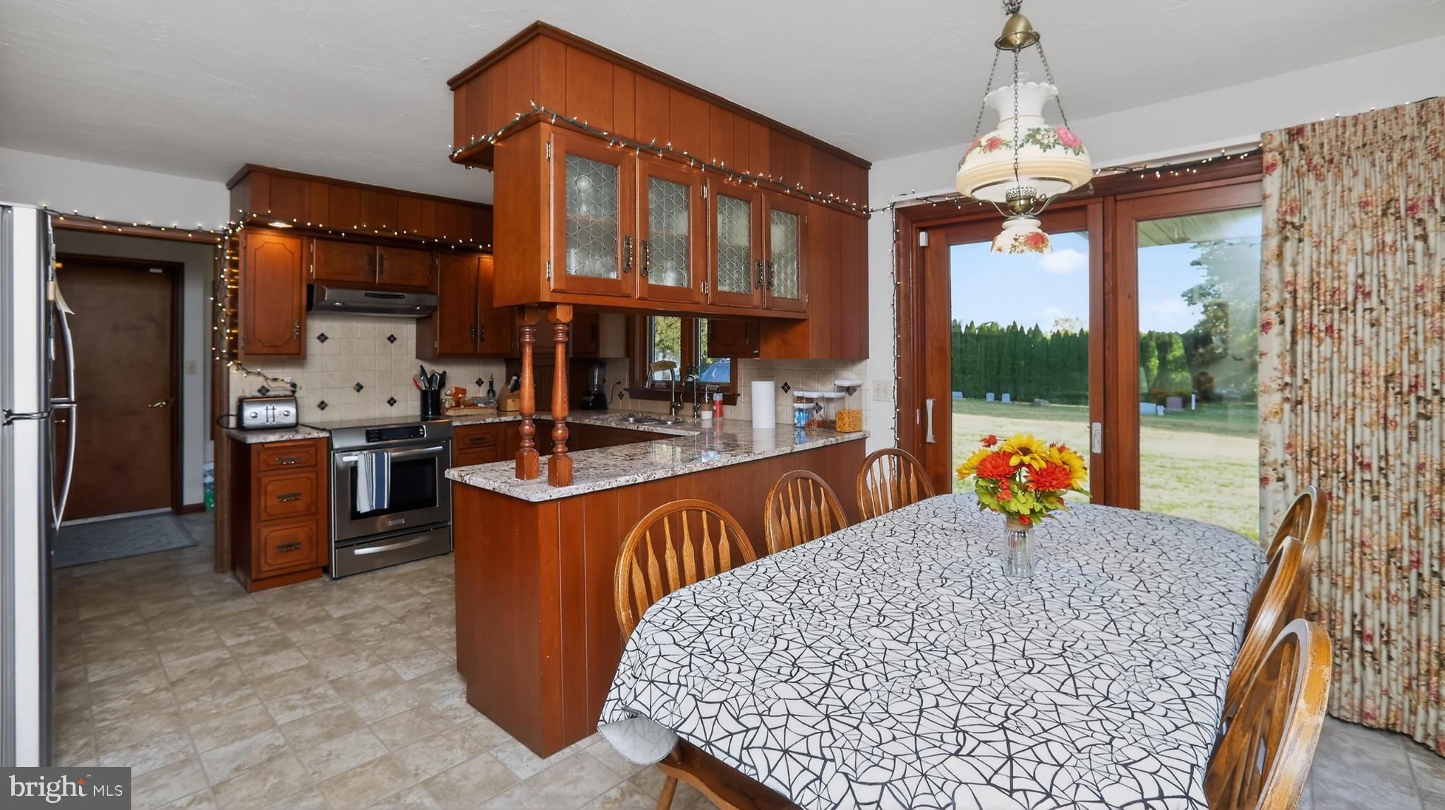 740 Lincoln Gardens Road Ephrata, PA 17522 - Photo 18 of 72 a view of living room kitchen with stainless steel appliances granite countertop furniture and a fireplace