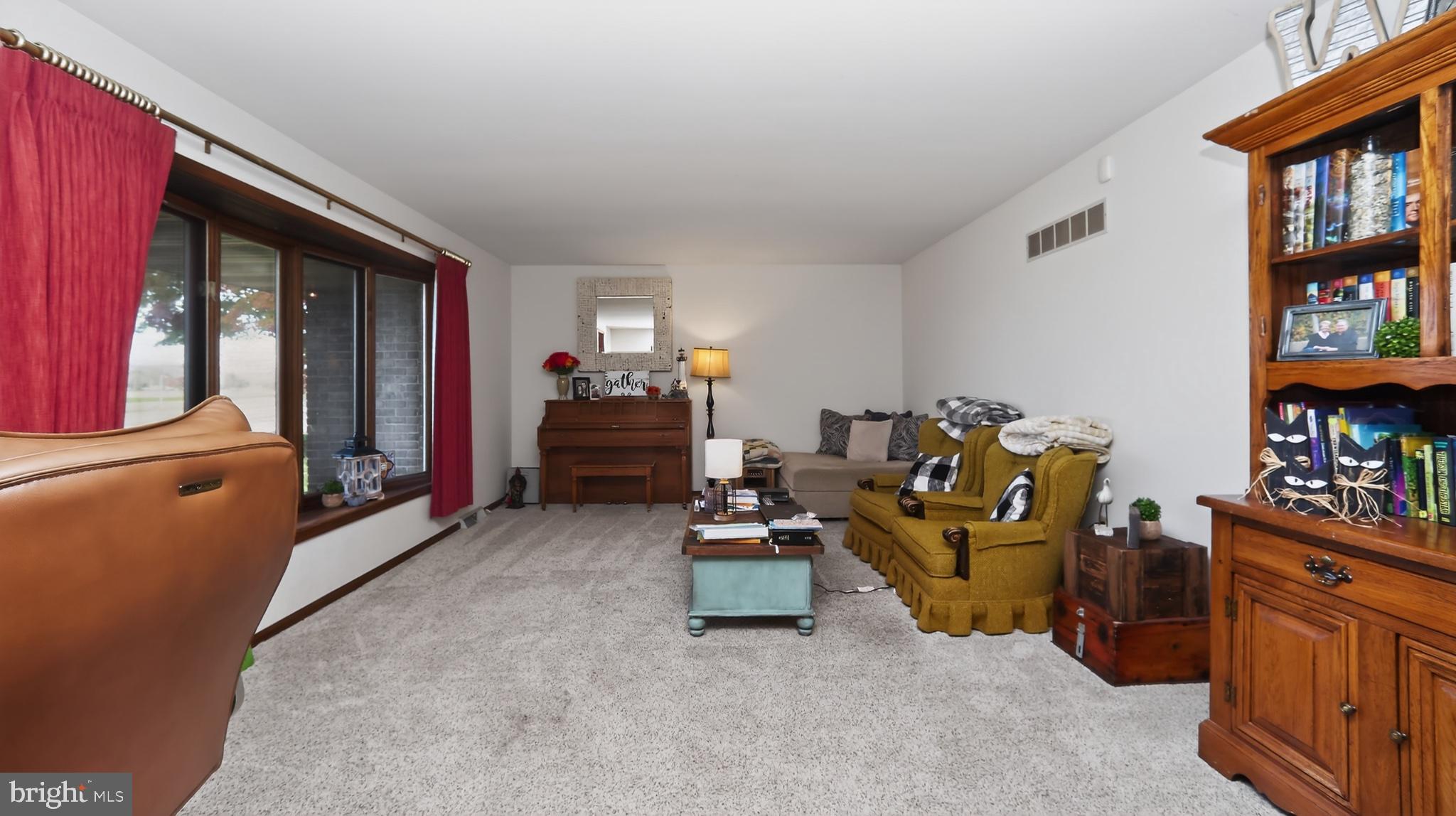 740 Lincoln Gardens Road Ephrata, PA 17522 - Photo 24 of 72 a room with furniture and a book shelf