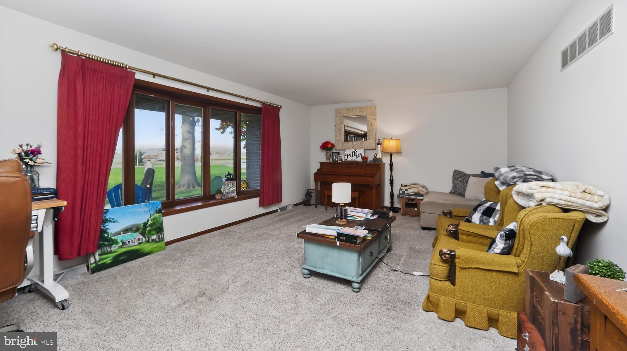 740 Lincoln Gardens Road Ephrata, PA 17522 - Photo 25 of 72 a living room with furniture and a fireplace